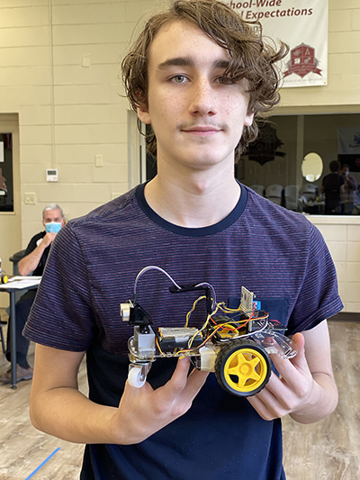 Summer Institute STEMS SEALs Student with Robotic Rover 1