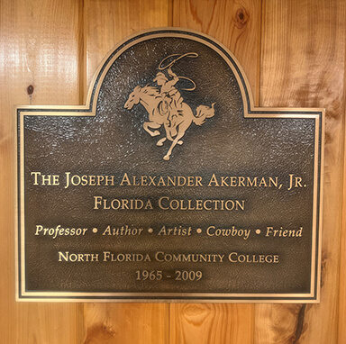 Bronze plaque honoring The Joseph Alexander Akerman Jr Florida Collection in NFC Library