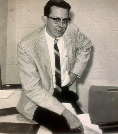 Historical photo of Joe Akerman in the classroom