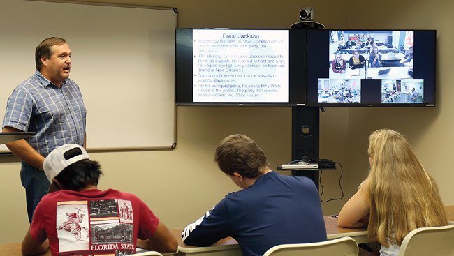 Professor Jay Welch teaching video conference class 2018