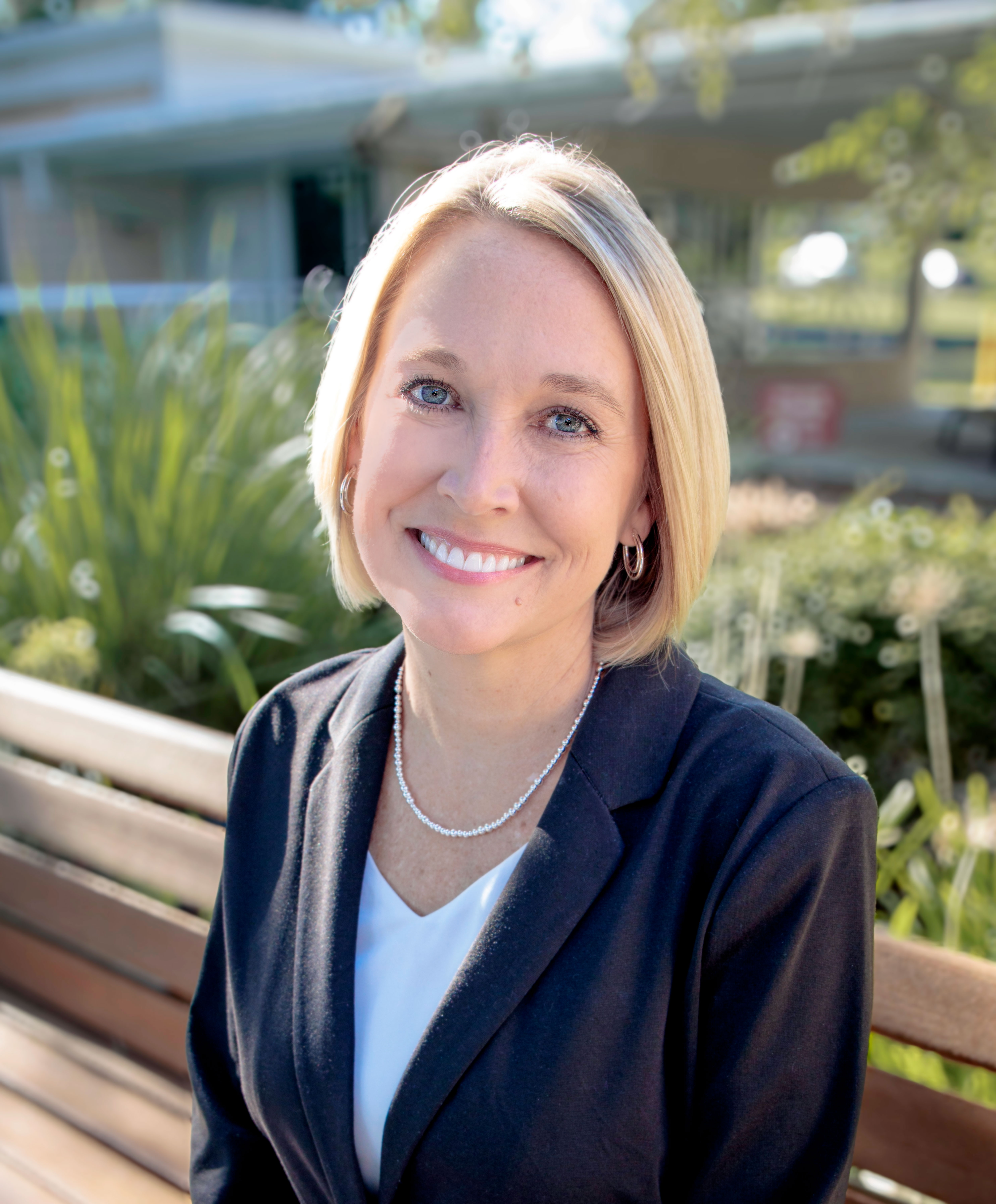 Dr Jennifer Page Sitting on a Bench