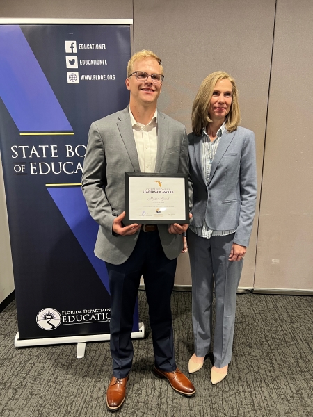 Mason Good photographed with Florida College System Chancelor Kathy Hebda