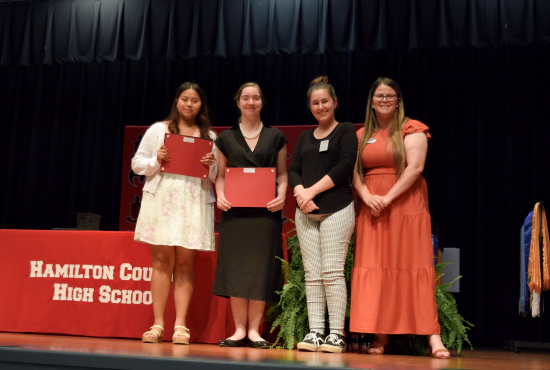 Caroline Mary Moffses Memorial Scholarship recipients Ana Hidalgo, Sarah Armstrong, NFC Coordinator of Scholarships Brienna Valentine pictured with First Federal Bank representative Casey Phelps.