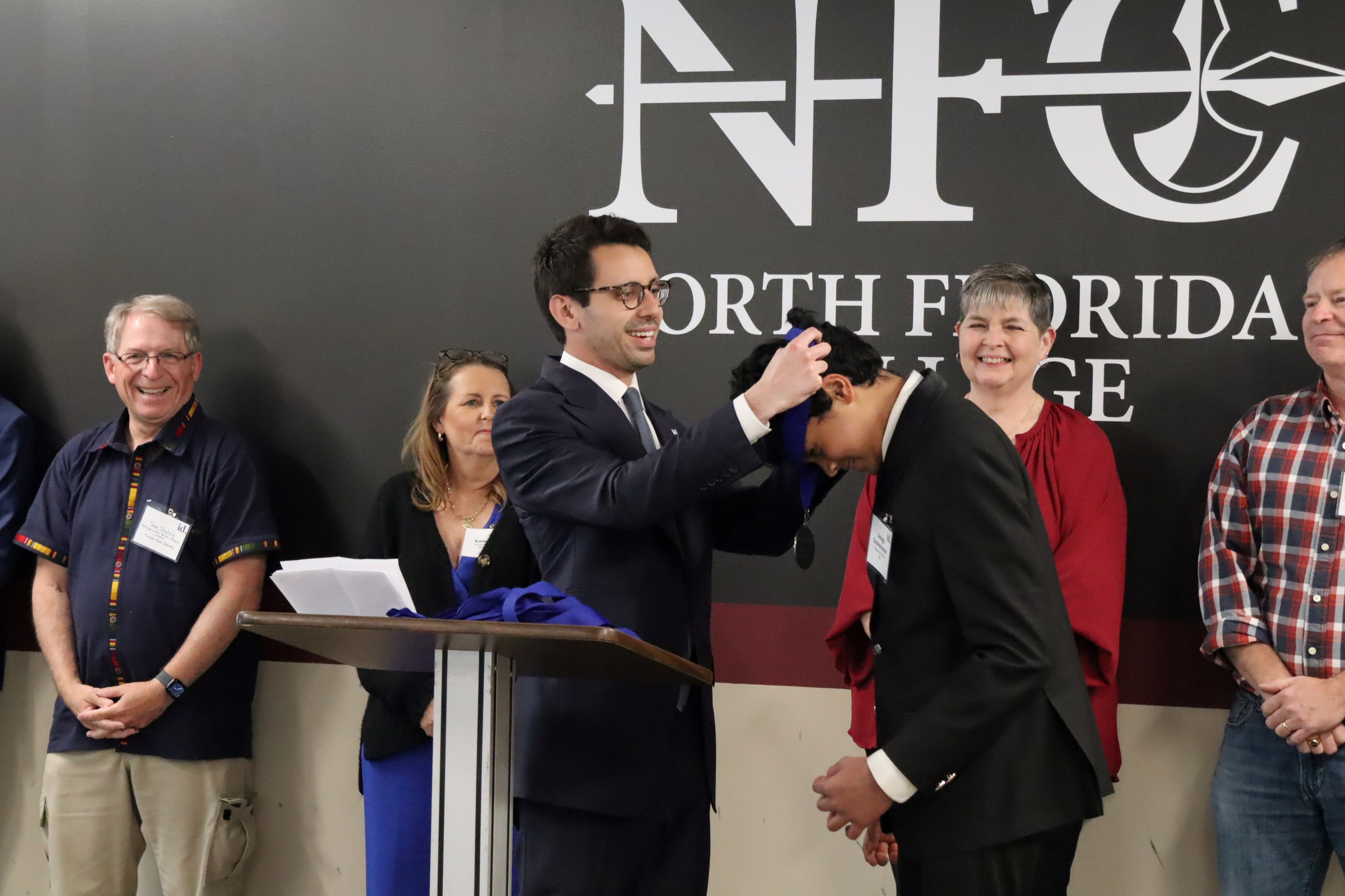 James Fishback, founder of Incubate Debate presents awards